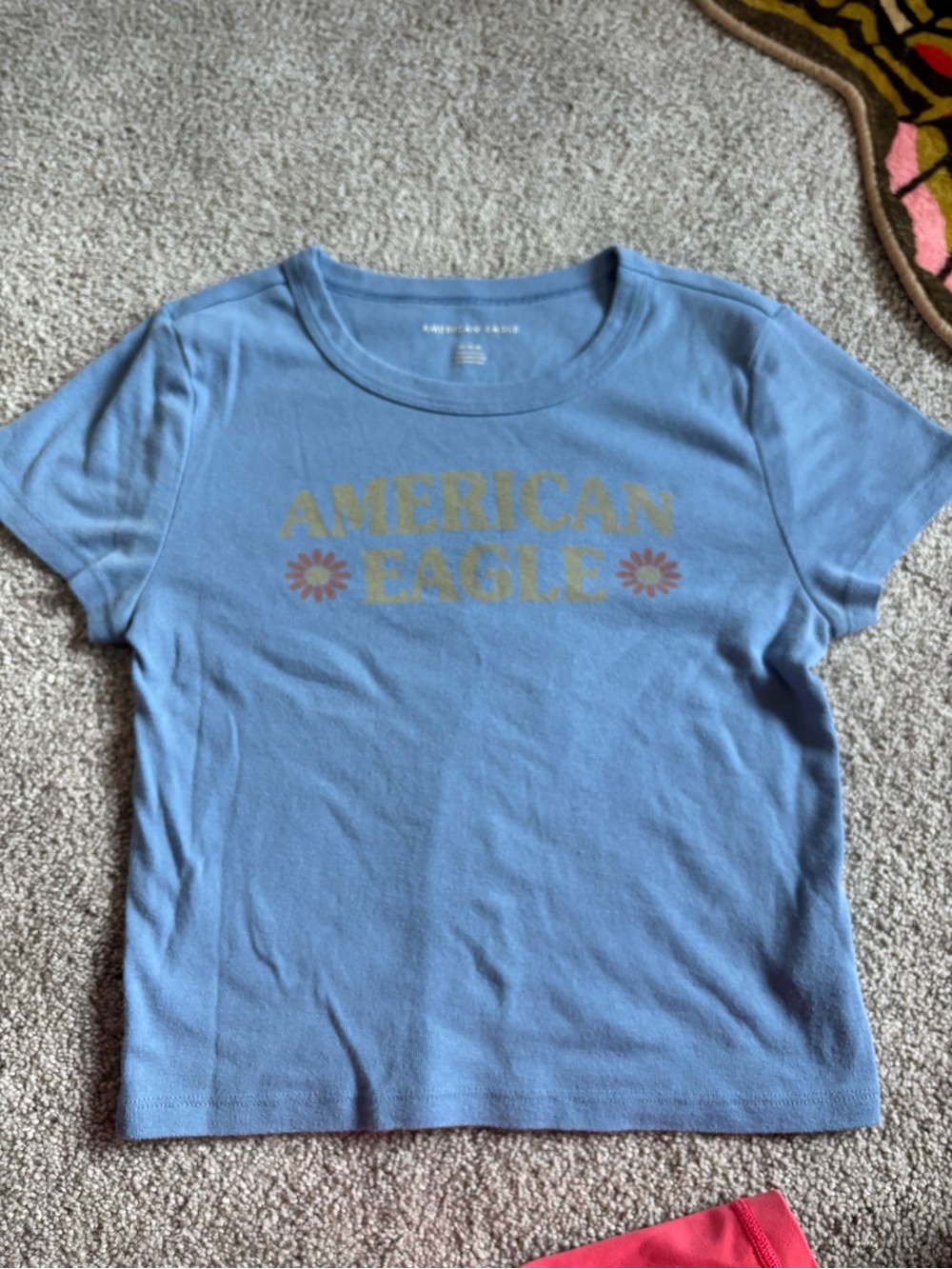 American Eagle Outfitters Light Blue Tee with Yellow Logo and Pink Flowers